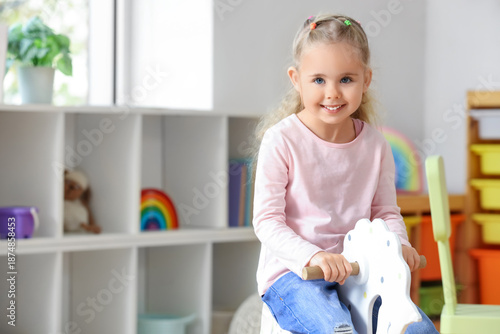 Cute little girl on rocking...