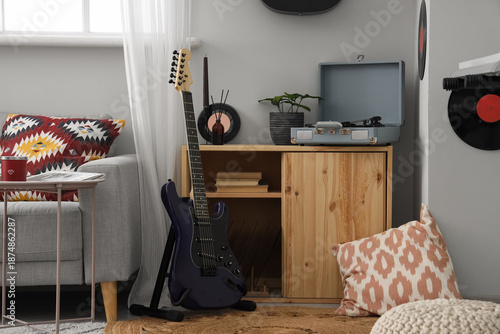 Electric guitar near chest ...