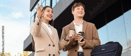 Young couple with coffee cu...
