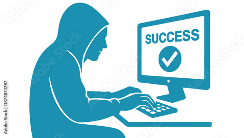 A person in a hoodie sitting at a computer with a success message on the screen