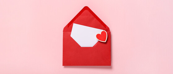 Composition with red envelope, blank card and paper heart on pink background. Valentine's Day celebration