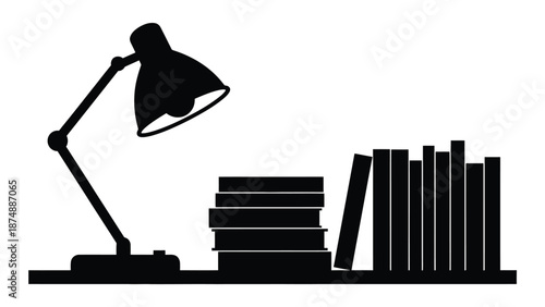 a black and white image of a desk lamp and books