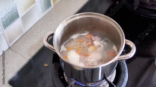 Preparing Homemade Baby Food by Boiling Ingredients on Stove