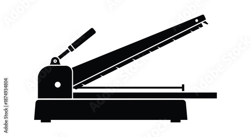 A striking black and white image of a paper cutter in a bold silhouette