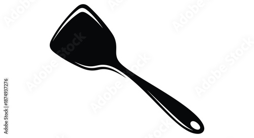 A simple black kitchen spatula displayed against a white background a striking silhouette