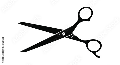 A striking black and white image depicting a pair of open scissors silhouette