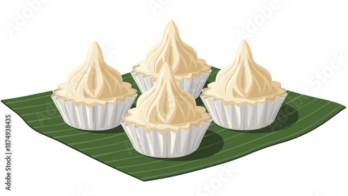 Four delicate and sweet traditional thai desserts with a swirled meringue-like topping are served in paper cups on a fresh green banana leaf.