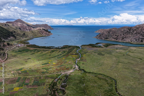Bilde på lerret River delta flowing into a lake alongside shores with high Andean grasslands