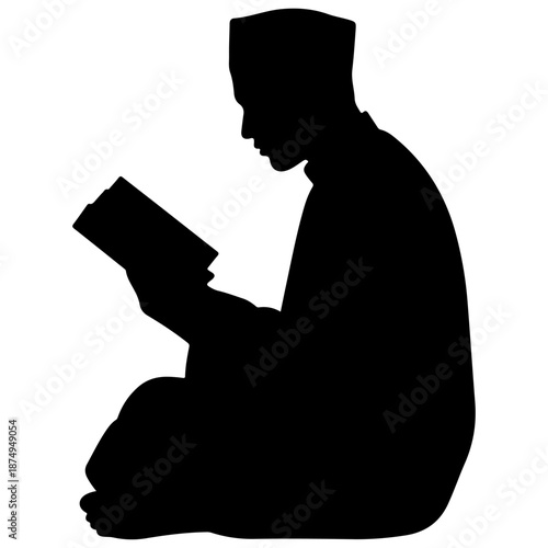 Silhouette of a Muslim man reading the Quran.