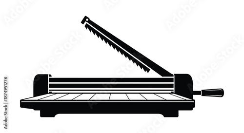 A striking black and white image of a paper cutter in a bold silhouette