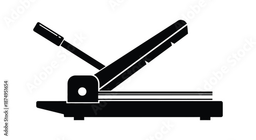 A black silhouette of a paper cutter with a blade and flat base silhouette