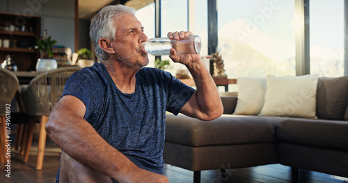 Fotografie Home, yoga and old man in lounge, drinking water and relax with break, hydration and rest