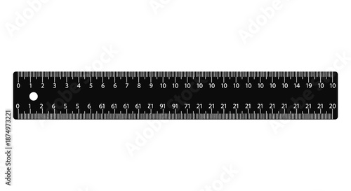 A black ruler with precise measurements displayed in centimeters and inches a striking silhouette