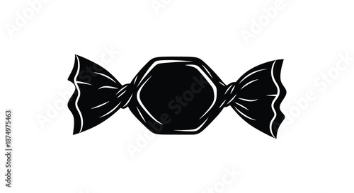 A striking black and white image of a wrapped candy presented as a bold silhouette