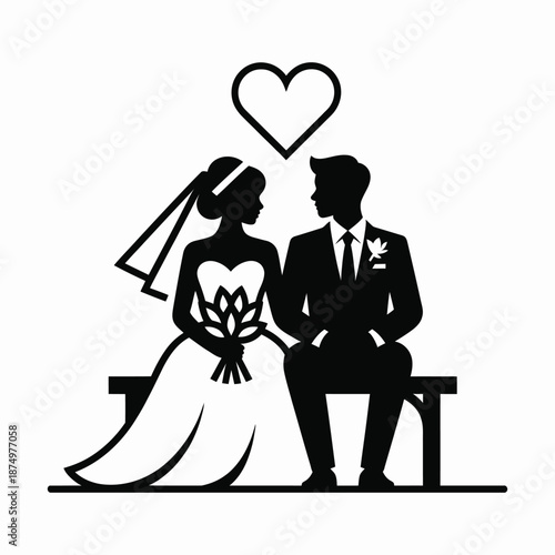A silhouette of a bride and groom sitting together with a heart floating above them