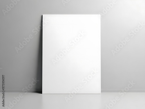 A blank white vertical poster mockup featuring realistic window sunlight shadows on a minimalist gray wall for professional designs