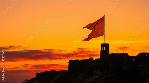 Saffron Maratha Flag Waving on a Historic Fort at Sunset, India