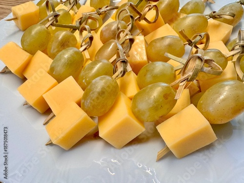 New Year's snack skewers hard cheese with grapes on the festive table