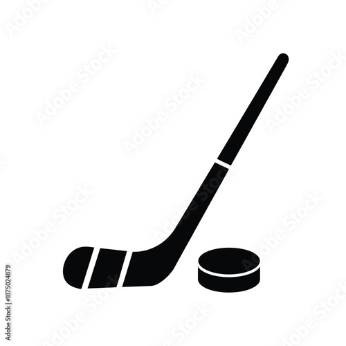 a black hockey stick and puck on a white background
