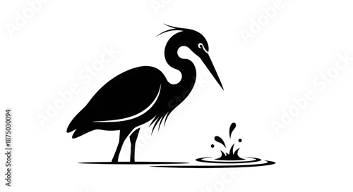 Silhouette of a heron bird standing in water looking at ripples and splashes