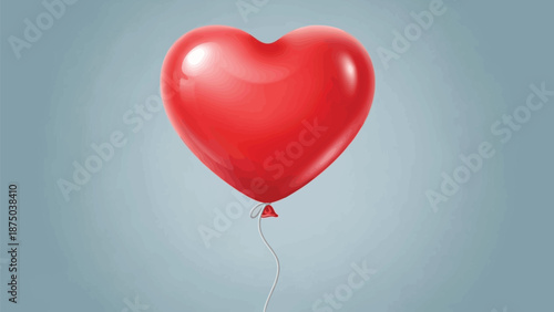 Shiny bright red heart shaped balloon floats gently against a smooth soft blue gray background symbolizing romance and affection