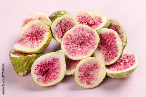 Fresh Sliced Figs with Pink Flesh on Pink Background