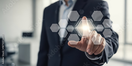 Businessman technology innovation digital touchscreen hexagon virtual interface concept futuristic Confident businessman using digital touchscreen interface with glowing hexagon virtual buttons