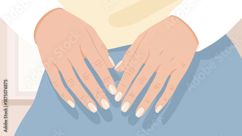 A person's hands with perfectly manicured nails resting on blue fabric, wearing a light-colored top