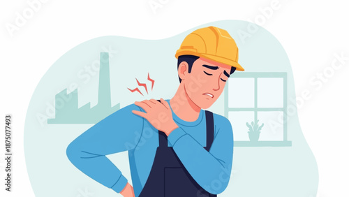 Construction worker in hard hat and overalls, wincing with shoulder pain at a factory site