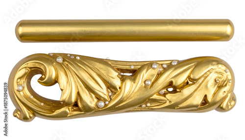 A gilded, ornate clip with pearls and a simple golden bar