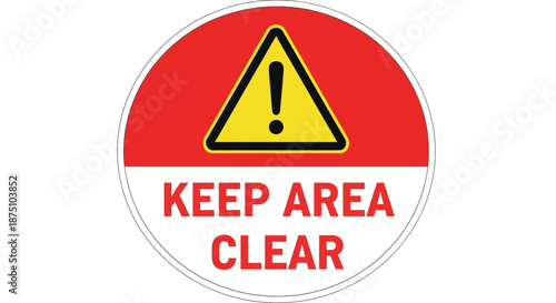 Circular safety warning sign indicating a 'Keep Area Clear' message with a yellow triangular exclamation mark, essential for workplace and public safety