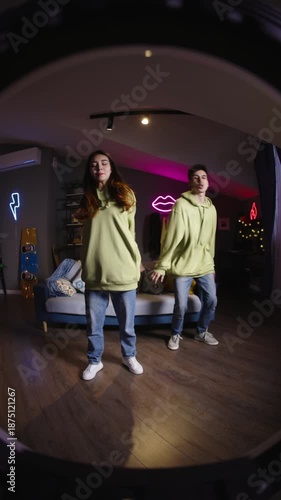 Wallpaper Mural Gen z teenagers recording casual dance video in stylish purple room modern youth lifestyle and digital generation concept Torontodigital.ca