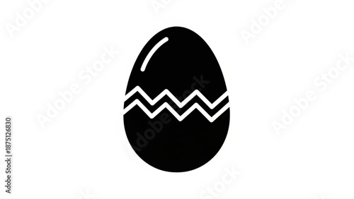 A black easter egg with white zigzag pattern on a plain white background