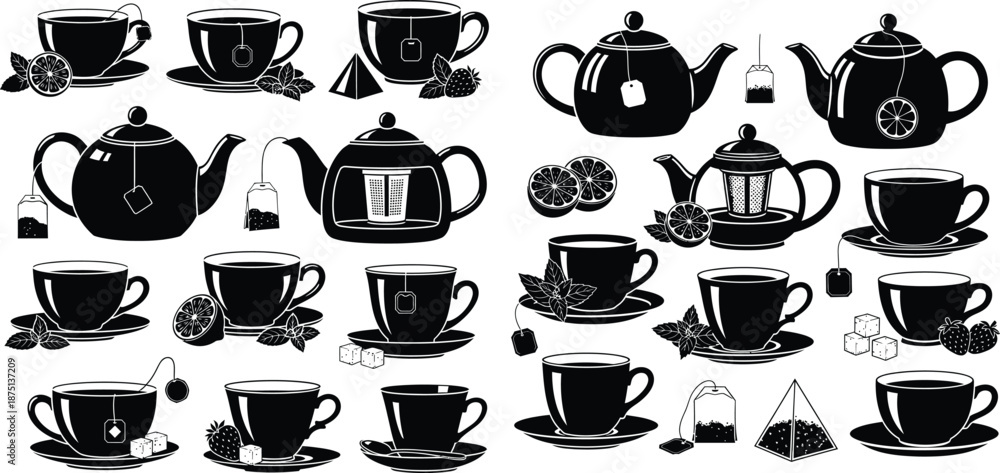 Fototapeta premium Assortment of black tea cups and teapots with citrus and fruit garnish elements