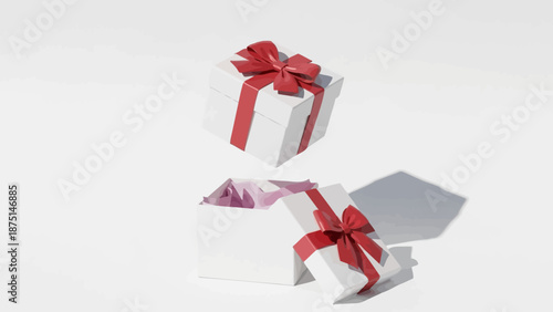 Two white gift boxes with red ribbons on a white background