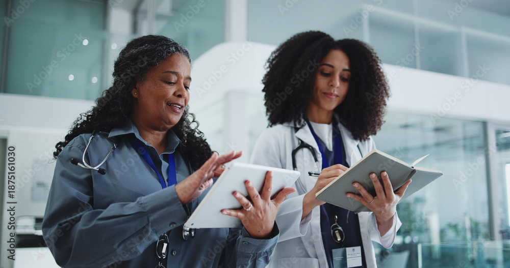 Obraz premium Tablet, notebook and doctors in hospital with discussion for medical service or surgery schedule. People, digital technology and team of healthcare employees with patient information in clinic.