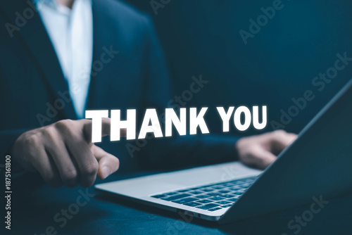 Business professional pointing thank you text above laptop, gratitude and appreciation concept, customer experience and confirmation message, positive business communication, corporate service.