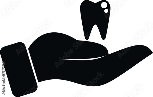 Hand holding tooth as a symbol of dental care and oral health