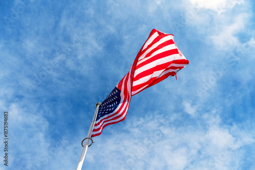Photos Low-angle view of the national flag of the United States of America waving on a