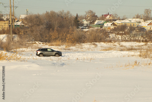 Modern SUV Driving Through Snowy Winter Landscape