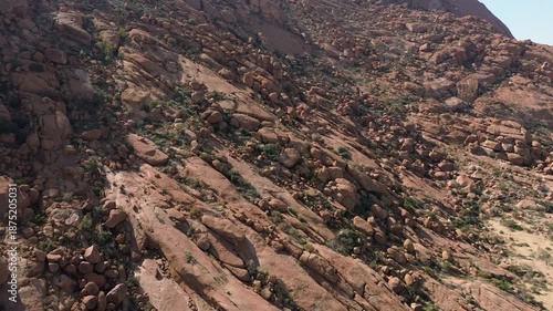 Drone view of orange rock formations and giant boulders in southern Namibia, Africa.