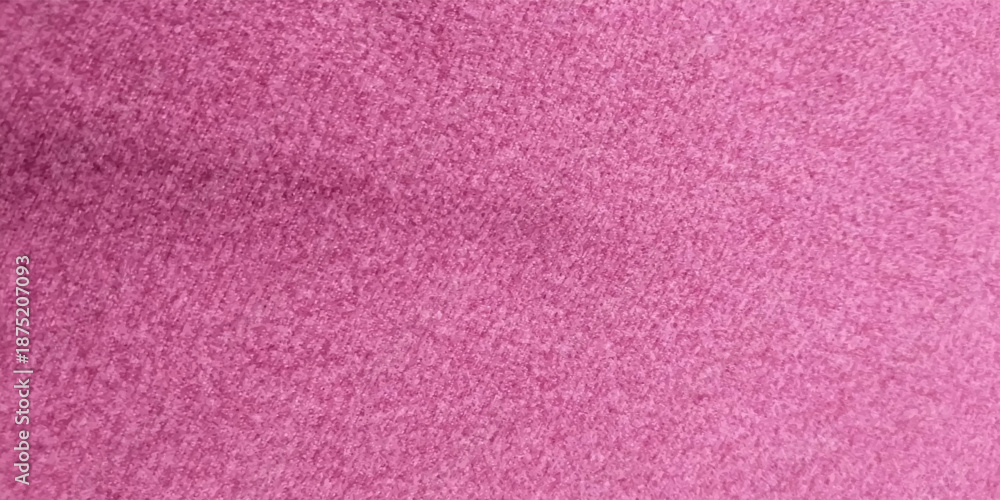 Fototapeta premium Close-up macro image of a pink textured fabric surface with fine fibers and subtle grain. Abstract background with soft pastel tones, ideal for use in design projects,