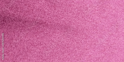 Close-up macro image of a pink textured fabric surface with fine fibers and subtle grain. Abstract background with soft pastel tones, ideal for use in design projects,