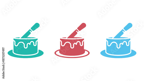 Colorful cake icons with icing and spatulas on plates