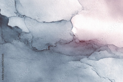 Abstract gray watercolor background with soft flowing stains and texture.