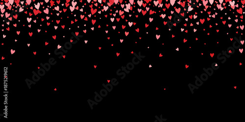 red and pink hearts floating down on black background
