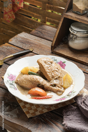 Ayam Masak Kurma is a traditional Malay chicken curry cooked with aromatic spices coconut milk and kurma seasoning offering a rich mildly spiced flavor commonly served for family meals and festive occ