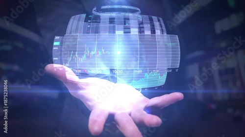 Close-up of a hand holding a holographic graph with blue light in a dark room.