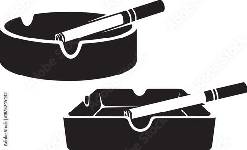 Black and white image of two cigarette ashtrays with cigarettes
