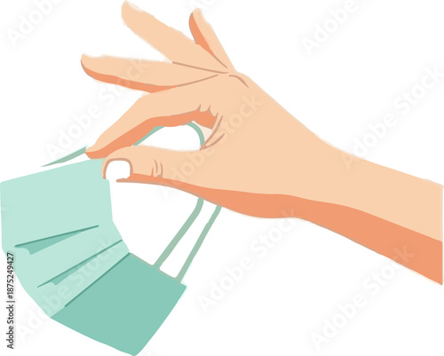 A hand holds a light blue medical mask by its ear loops